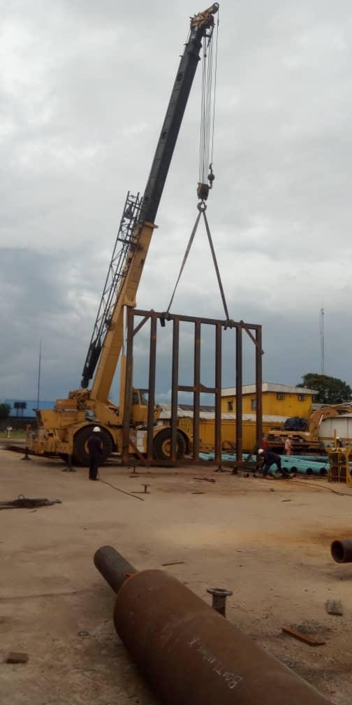 Lifting frame hoisted by mobile crane at the fabrication yard