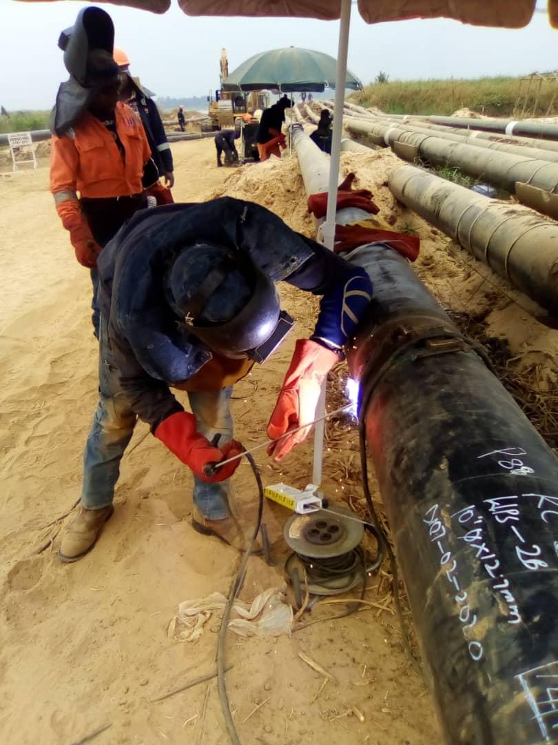 Welder joining a section of the bulk pipeline