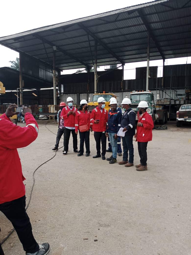 Crew and site team on the workshop floor